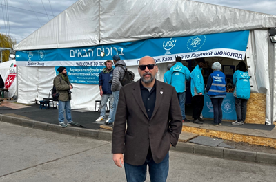 Kevin Sowti stands outside of a medical tent in Ukraine